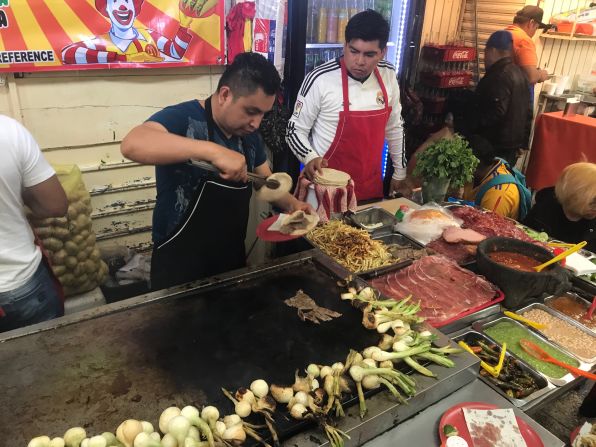 <strong>La Merced: </strong>At Tacos McTeo, adding <em>papas fritas</em> -- French fries -- to their tacos is a specialty. The taqueria is one of many stalls inside Mexico City's Mercado de la Merced.
