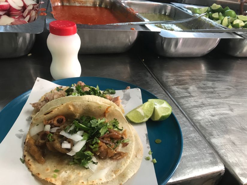 <strong> A don't-miss taqueria: </strong>Tripe and <em>suadero</em> tacos at Cinco Hermanos, another market eatery. 