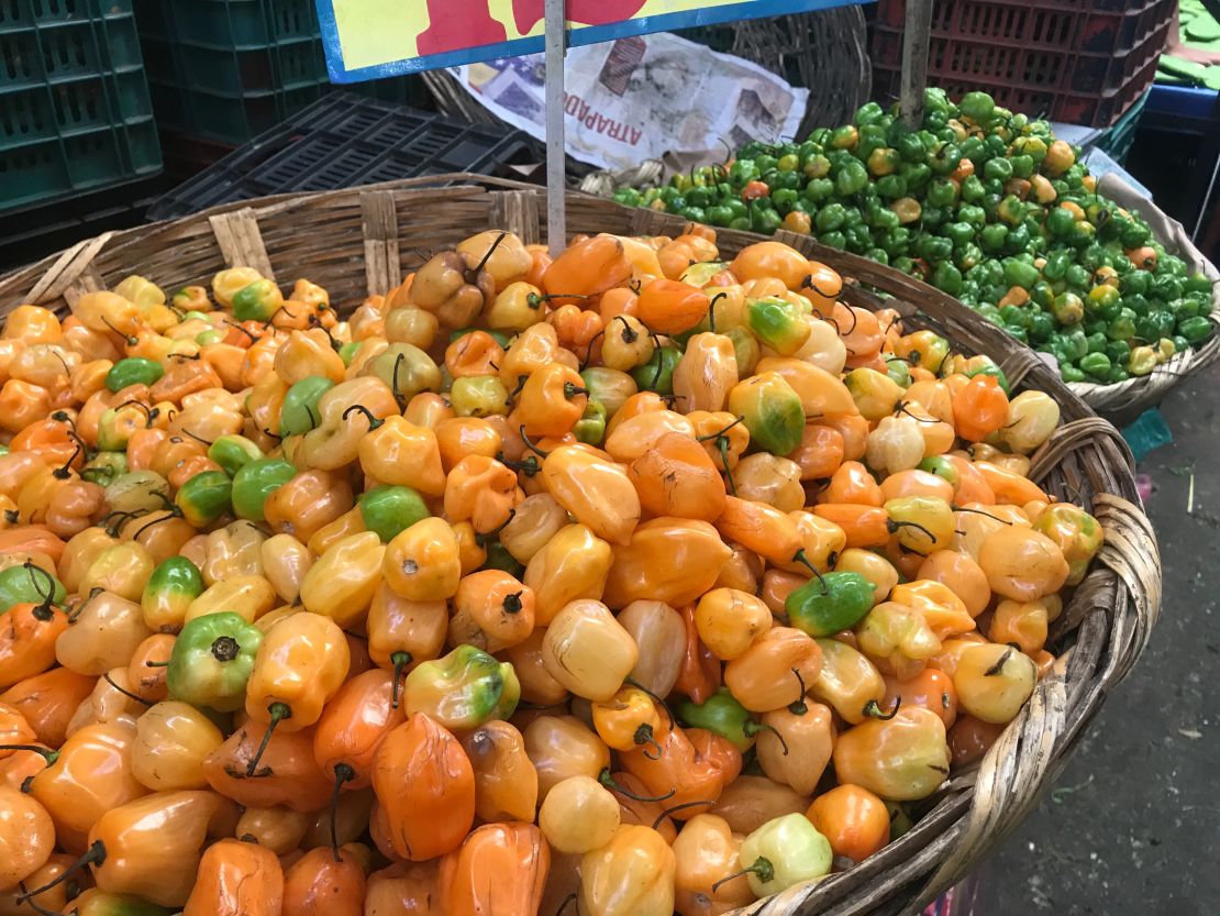 A basketful of habaneros in the vegetable section of the market. 