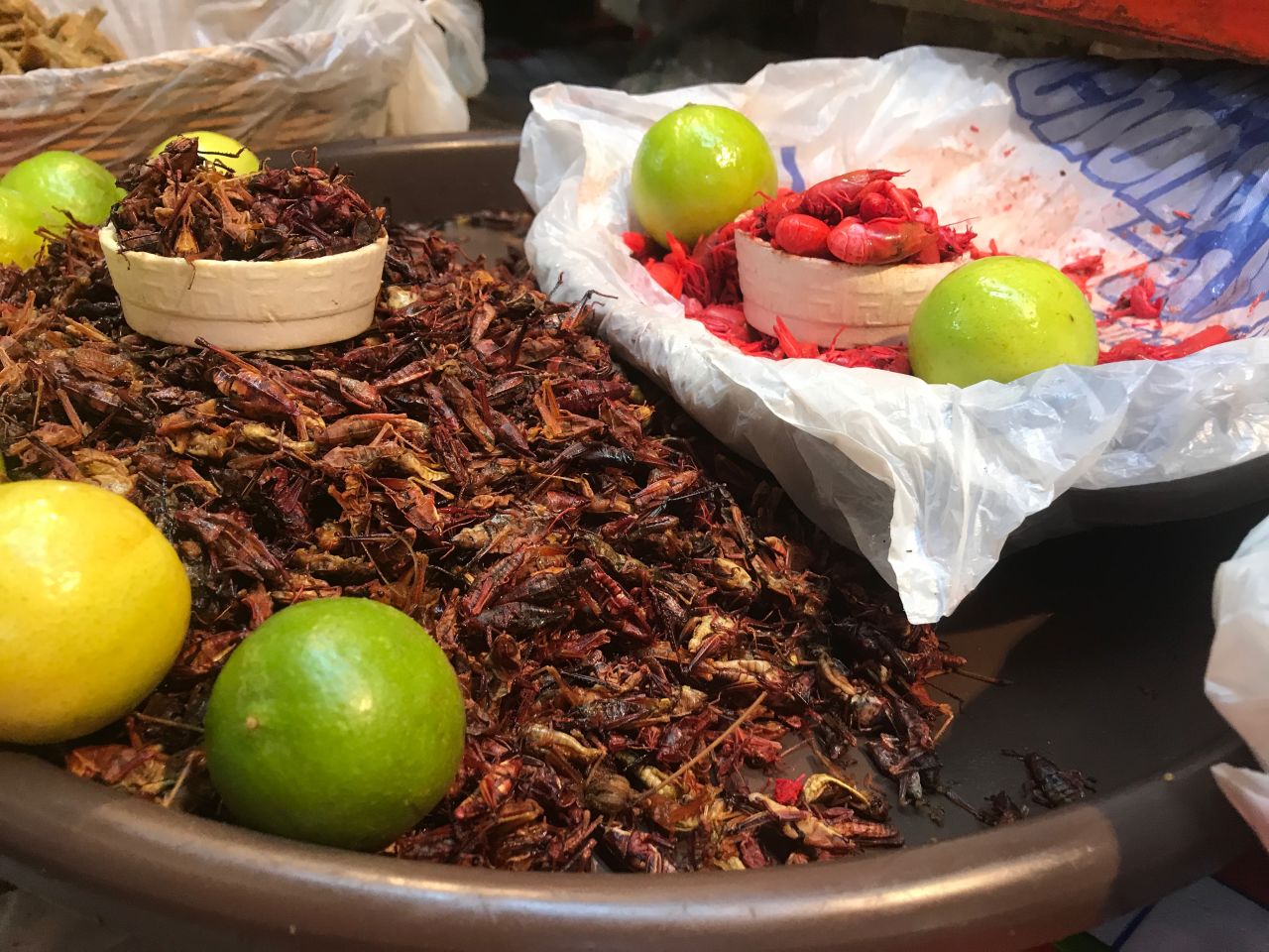 Chapulines -- grasshoppers -- are a tasty snack that has survived since pre-Hispanic times. To the right are acociles, tiny shellfish.