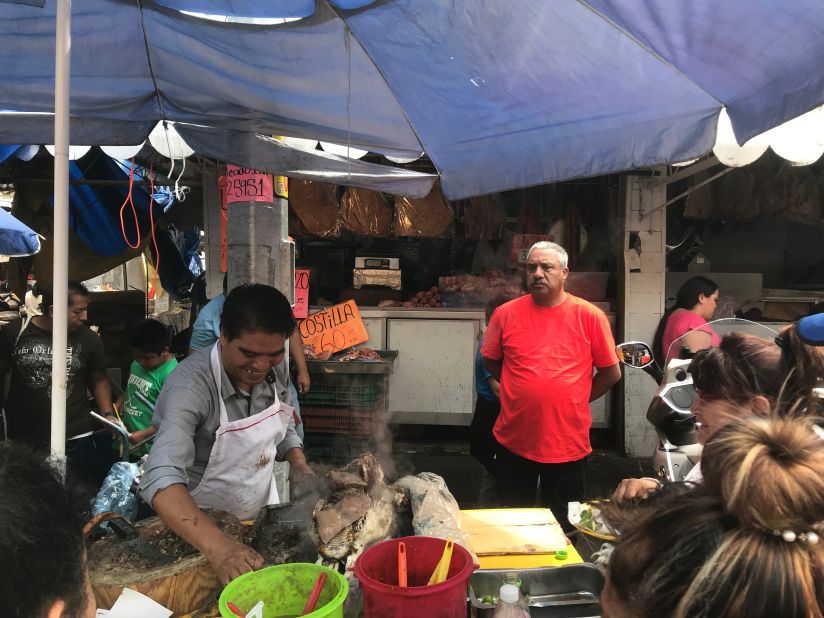 <strong>An acquired taste</strong>: <em>Tacos de cabeza</em> -- beef head tacos -- can be found outside the Nave Mayor, in the road that runs between the market and the meat section. 