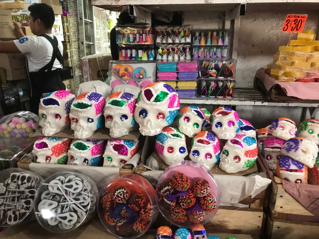 Small candy skulls made of amaranth -- an ancient grain which predates the Hispanic era -- lie stacked alongside other skeleton-themed snacks ahead of the Day of the Dead.