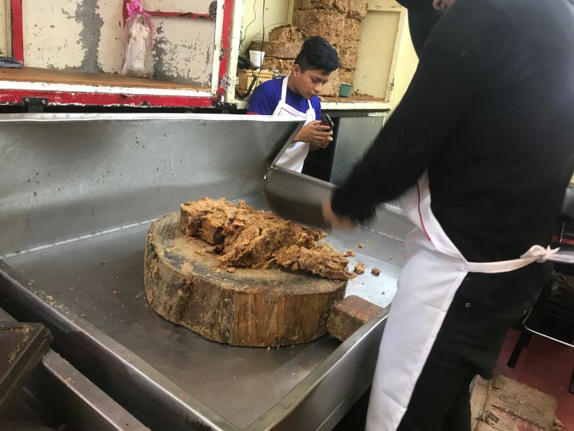 <strong>Meat in many forms: </strong>Workers deconstruct huge cakes of <em>chicharrón prensado</em> -- pressed pork -- deconstructing them once again, for gorditas, tacos or to be added to salsas.