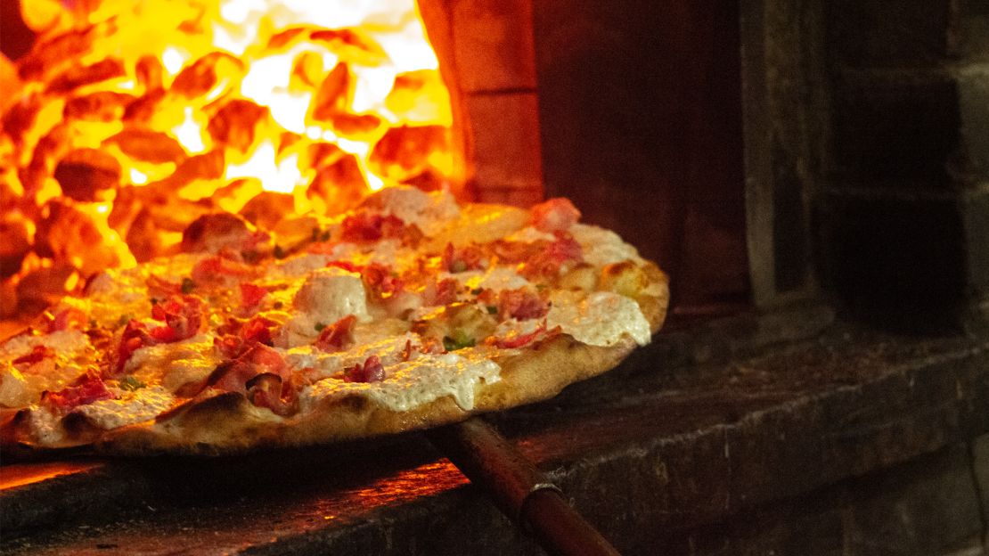 The House Special No. 1 coming out of the oven at Juliana's in Brooklyn, NY is actually better than its neighbor's pies at Grimaldi's.