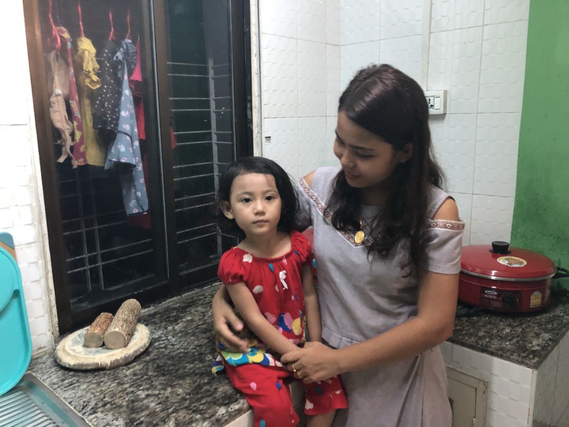Chit Su Win, wife of Kyaw Soe Oo, with their 3-year-old daughter Moe Thin Wai Zan. They just moved to Yangon from Sittwe to be closer to the jail.