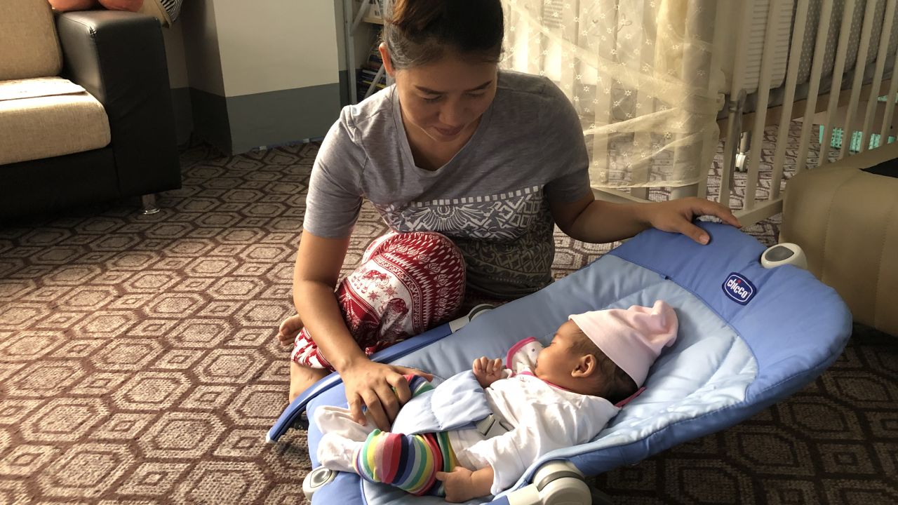 Pan Ei Mon, wife of Wa Lone, with their daughter Thet Htar Angel, who was born on August 10.