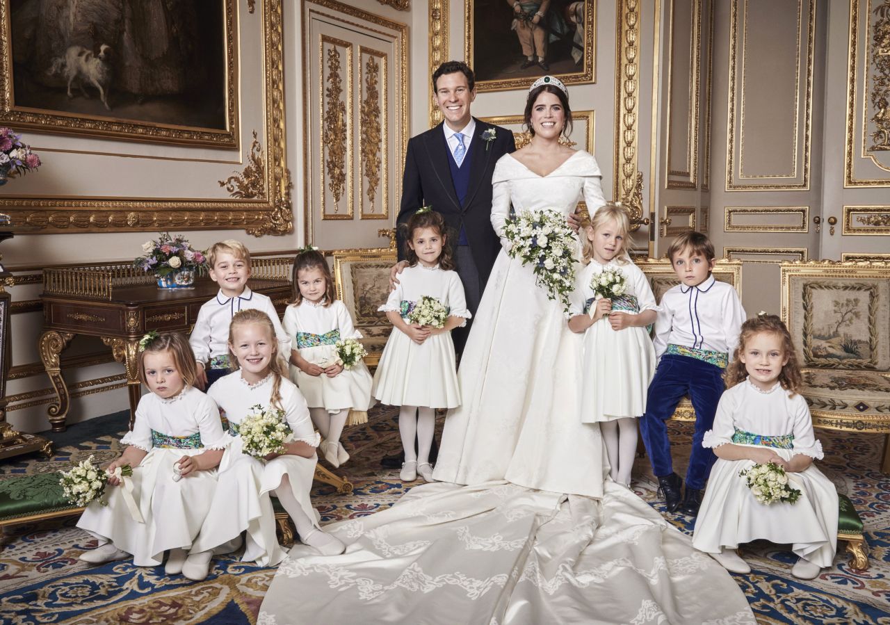 Britain's Princess Eugenie of York and Jack Brooksbank are photographed in Windsor Castle after<a href="https://www.cnn.com/style/article/princess-eugenie-jack-brooksbank-royal-wedding-intl/index.html" target="_blank"> their wedding</a> at St. George's Chapel on Friday, October 12. Their young attendants are, back row, from left: Prince George, Princess Charlotte, Theodora Williams, Isla Phillips, Louis De Givenchy; front row, from left: Mia Tindall, Savannah Phillips and Maud Windsor. 