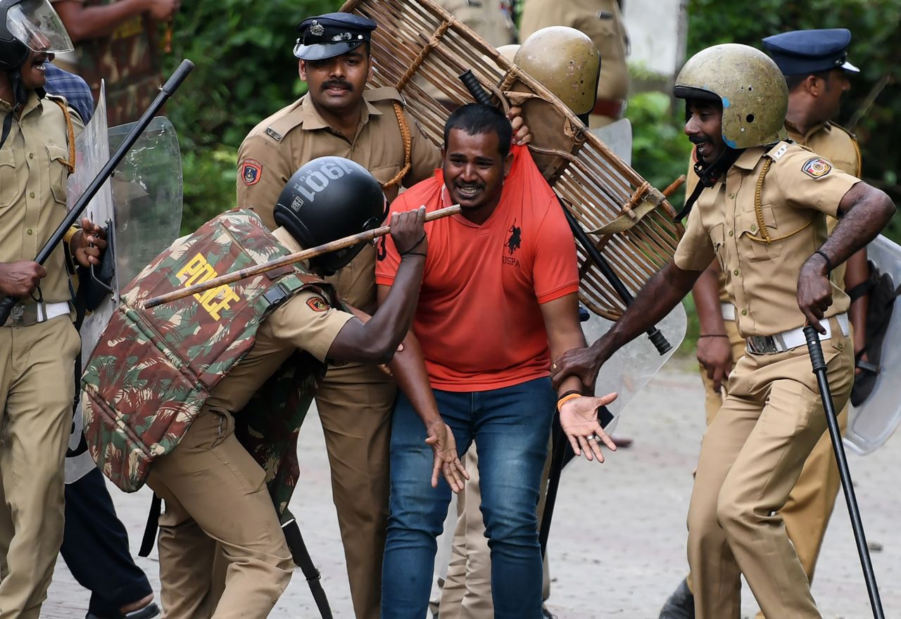 Indian police beat a Hindu activist as he pleads for his safety <a href="http://www.cnn.com/2018/10/18/asia/sabarimala-temple-protests-kerala-intl/index.html" target="_blank">as protesters rallied against a Supreme Court verdict</a> revoking a ban on women's entry to a Hindu temple in Nilackal, India, on Wednesday, October 17.