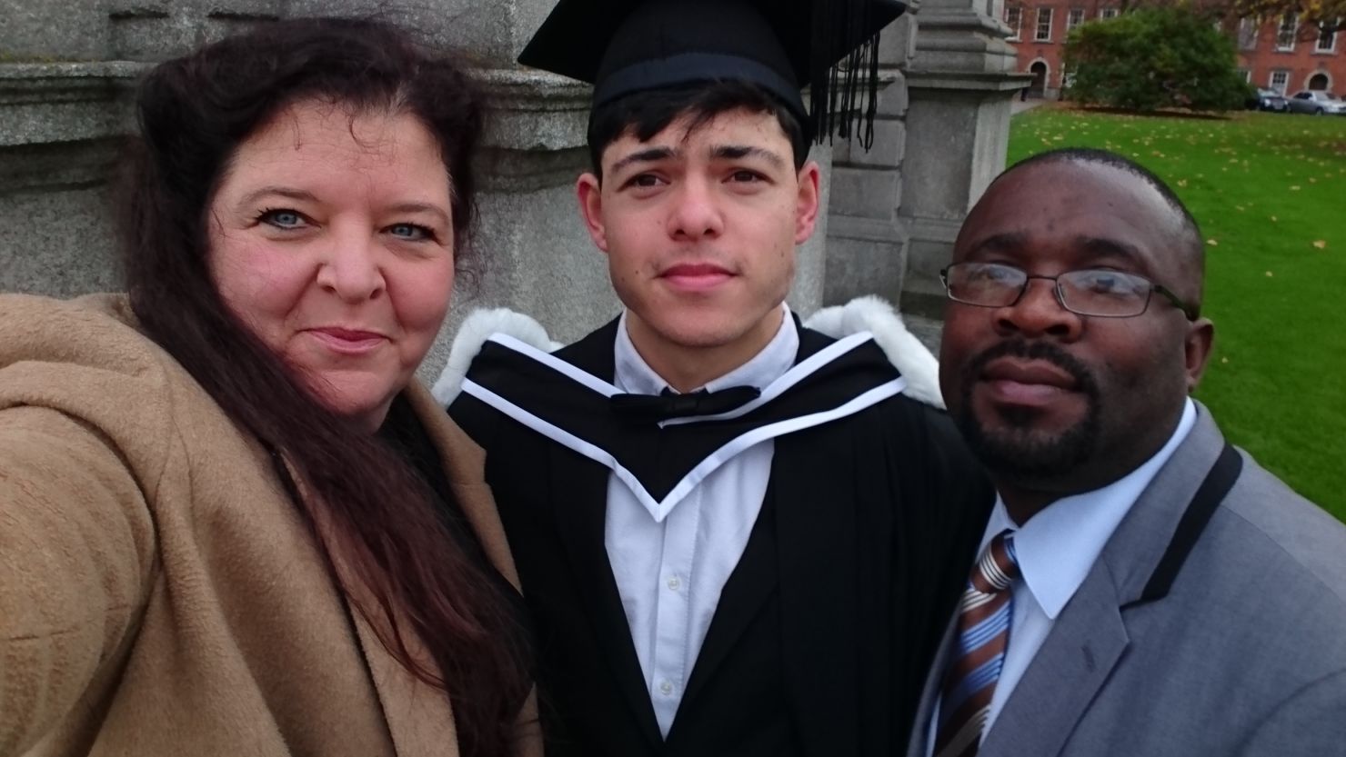 From left to right, Fanny Binder, Sean Binder and his stepfather, Desire, at Sean's graduation ceremony.