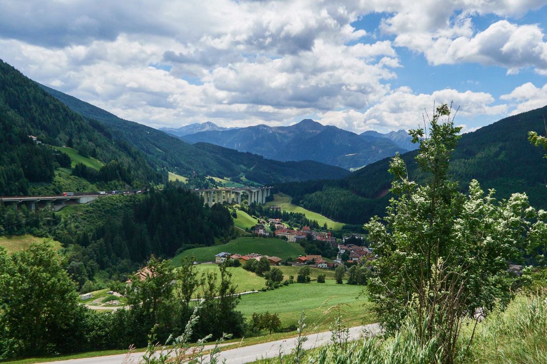 View of the mountains of South Tyrol next to the motorway bridge of the Brenner Highway.