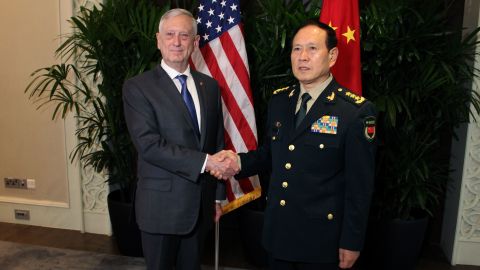 US Defence Secretary Jim Mattis shakes hands with his Chinese counterpart General Wei Fenghe in Singapore on October 18.
