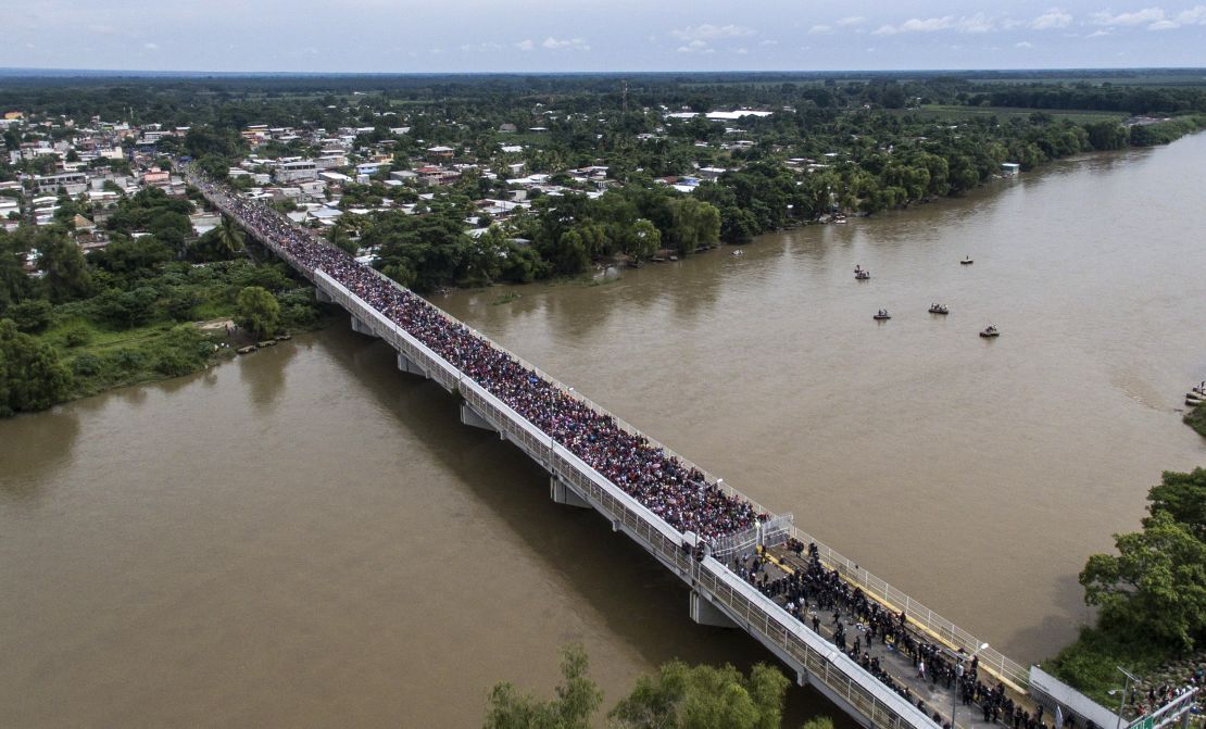 An aerial view shows the migrant caravan waiting on the Guatemala-Mexico international bridge in Ciudad Hidalgo, Chiapas state, Mexico.