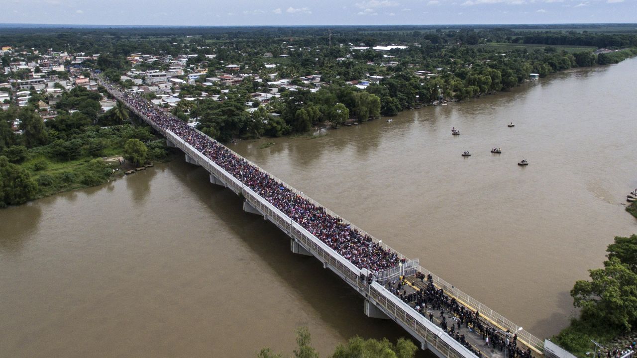 An aerial view shows the migrant caravan waiting on the Guatemala-Mexico international bridge in Ciudad Hidalgo, Chiapas state, Mexico.