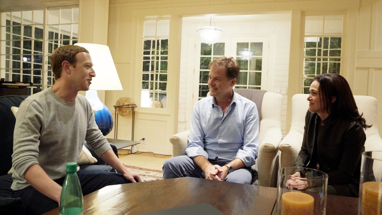 An undated handout from Facebook shows Zuckerberg and Sandberg meeting with Clegg. 