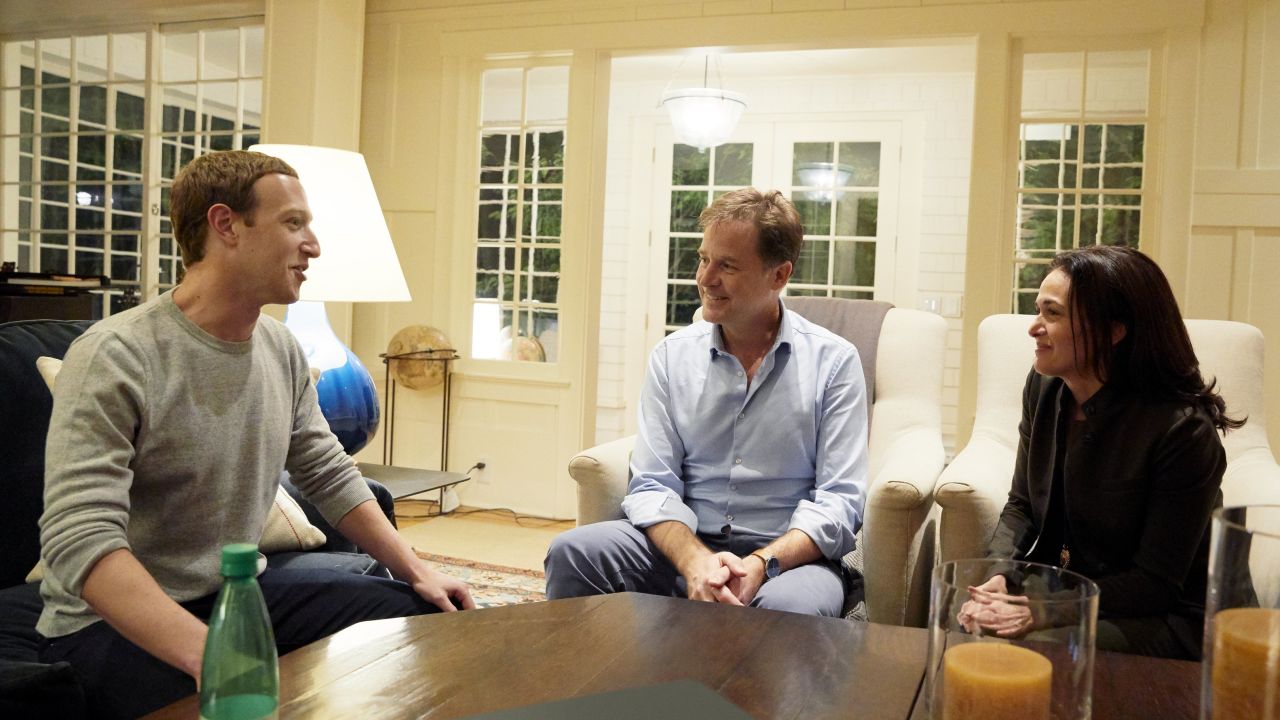 An undated handout from Facebook shows Zuckerberg and Sandberg meeting with Clegg.