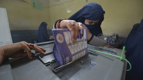A woman casts her vote at a polling station in Jalalabad, the capital of Afghanistan's eastern Nangarhar province.