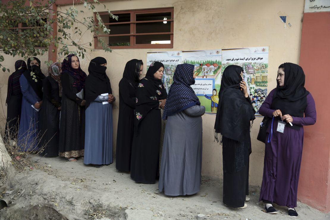 Afghan women line up to cast their votes Saturday outside a polling station in Kabul.