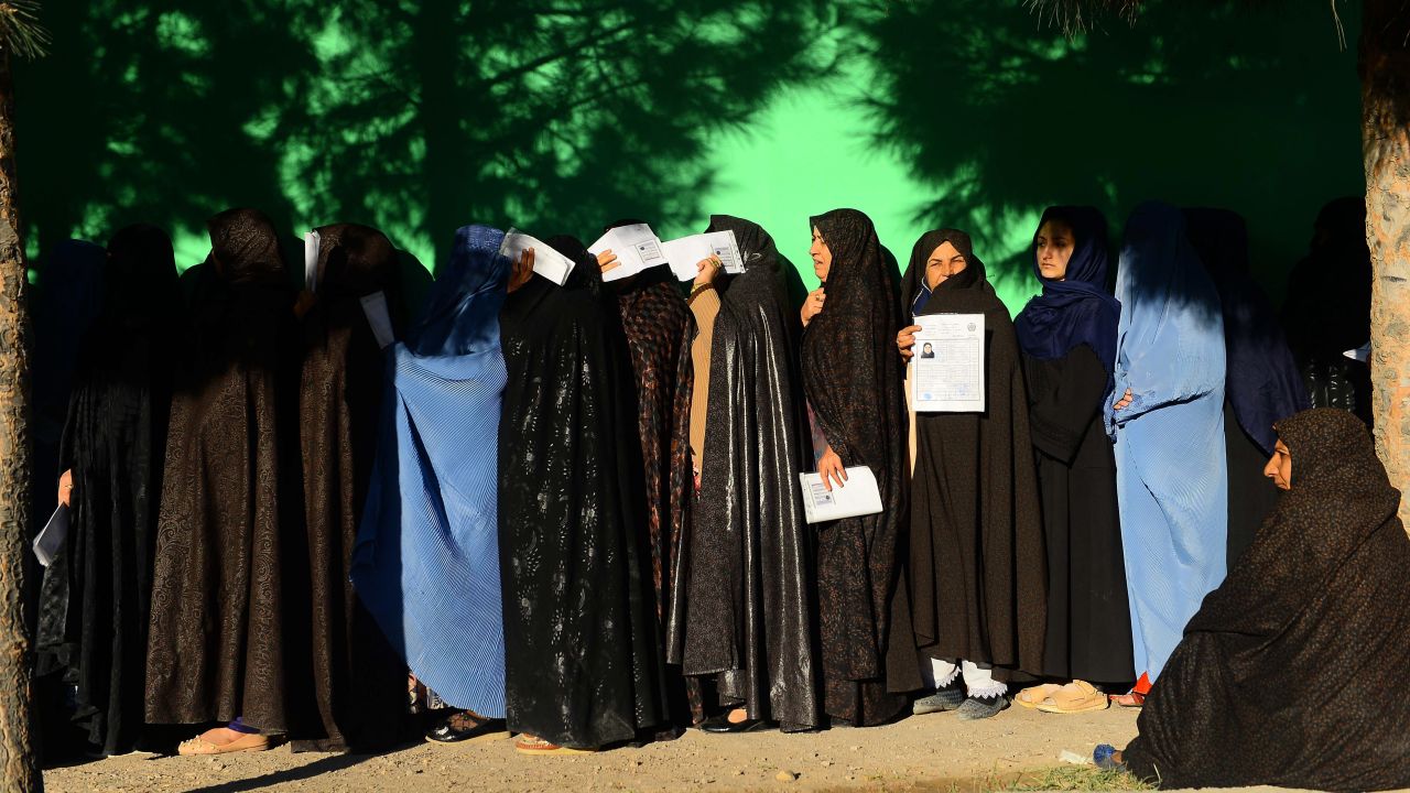 Afghan women wait in line to vote at a polling center in Herat province on Saturday.