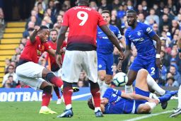 Martial swivels to score Manchester United's first goal.