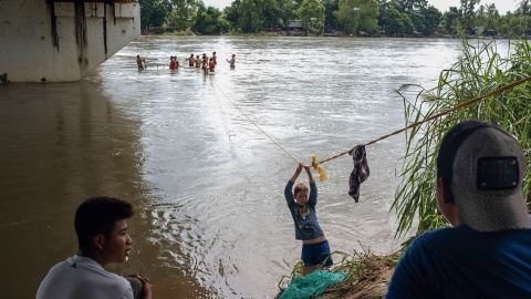 Central American migrants used a rope to get across part of Suchiate River. 