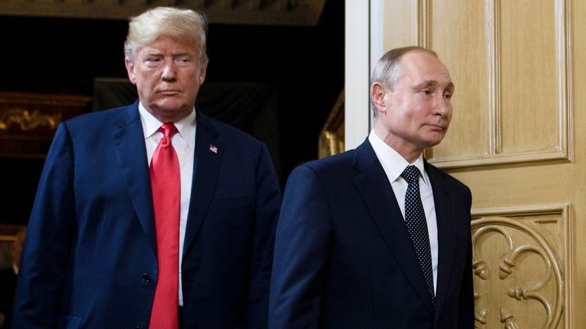 US President Donald Trump (L) and Russian President Vladimir Putin arrive for a meeting in Helsinki, on July 16, 2018. 