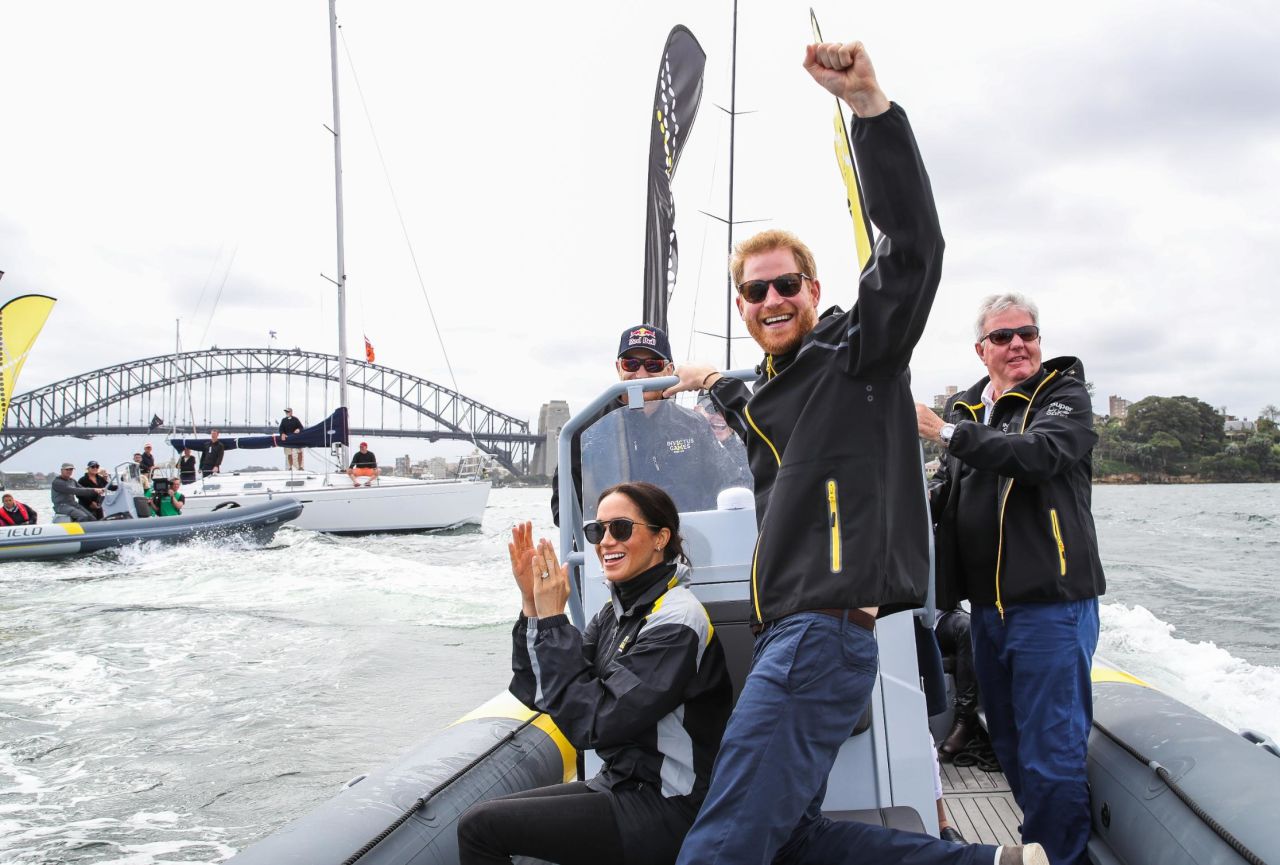 Harry and Meghan cheer on sailors during day two of the Invictus Games in Sydney on Sunday. 