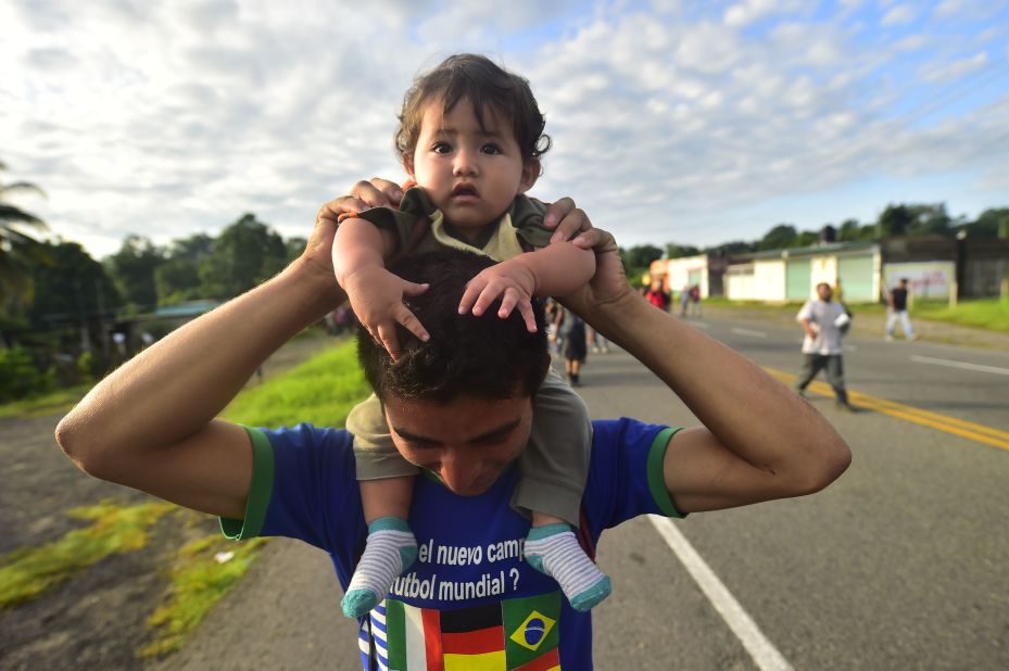 Honduran migrants, part of a caravan heading toward the United States, travel on the road linking Ciudad Hidalgo and Tapachula, Chiapas state, Mexico, on Sunday.