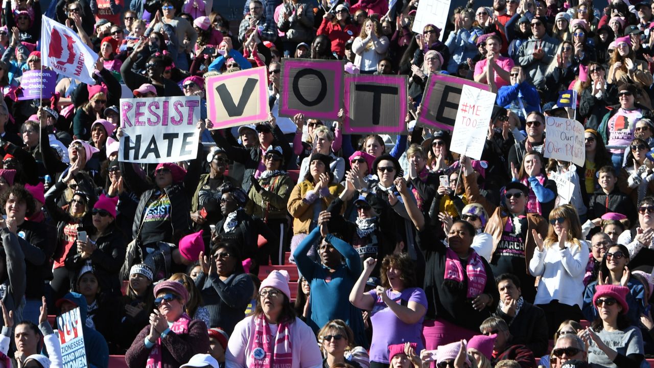 Demonstrators attend the Women's March "Power to the Polls" voter registration tour launch at Sam Boyd Stadium on January 21, 2018, in Las Vegas.