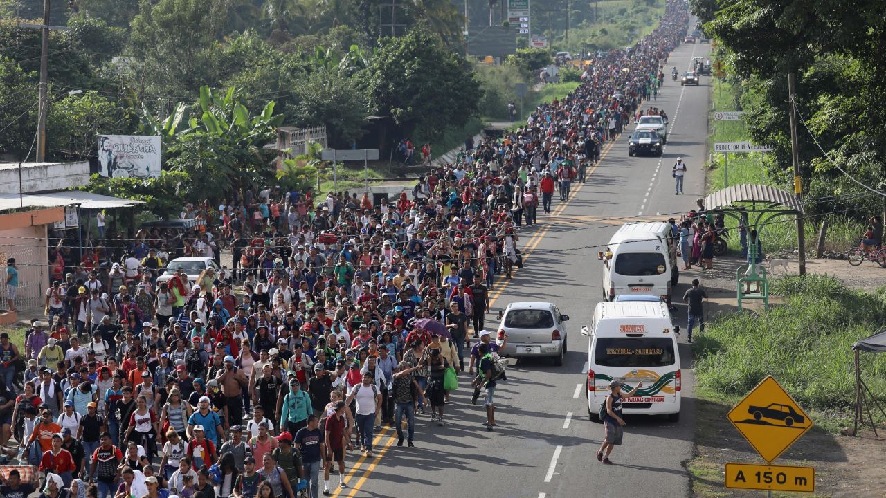 Members of the migrant caravan walk into the interior of Mexico after crossing the Guatemalan border on October 21, 2018 near Ciudad Hidalgo, Mexico.