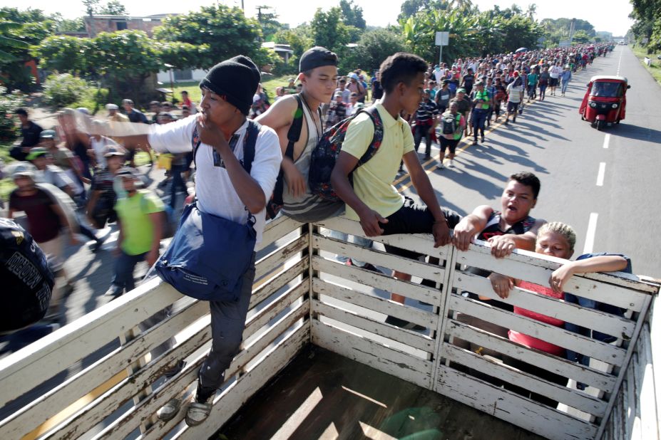 Central American migrants hitchhike along the highway near the border with Guatemala, as they continue their journey trying to reach the United States.