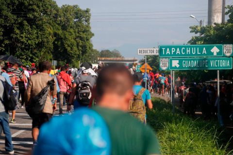 Central American migrants walk north toward Tapachula after departing Ciudad Hidalgo, Mexico.