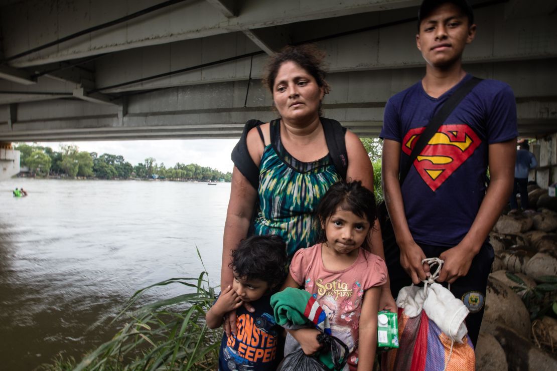 The Guillermo family pose for a photo, moments after reaching Mexico. Rosalin stands with her son Miner, 16, three-year-old Carlitos and Candy, 5.