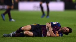 BARCELONA, SPAIN - OCTOBER 20: Lionel Messi of FC Barcelona lies on the floor after appearing to pick up an injury during the La Liga match between FC Barcelona and Sevilla FC at Camp Nou on October 20, 2018 in Barcelona, Spain. (Photo by Alex Caparros/Getty Images)