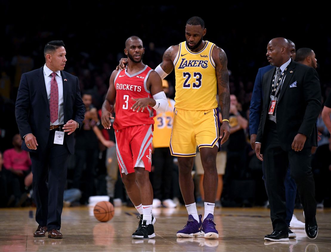 LeBron James escorts Chris Paul of the Houston Rockets after an on-court fight.