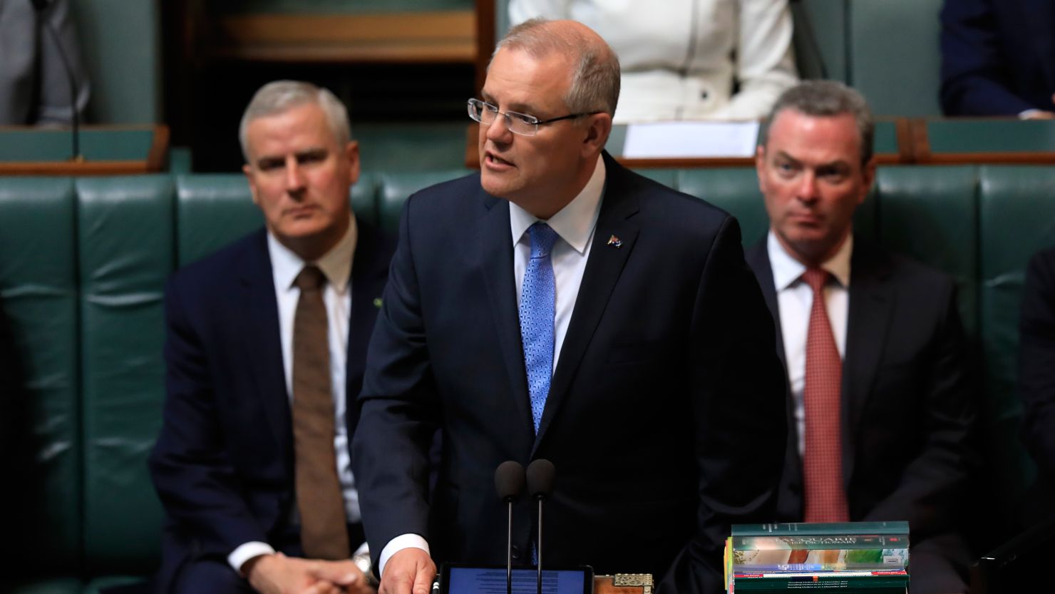 Australia's Prime Minister Scott Morrison (C) delivers a national apology to child sex abuse victims in Canberra on October 22.