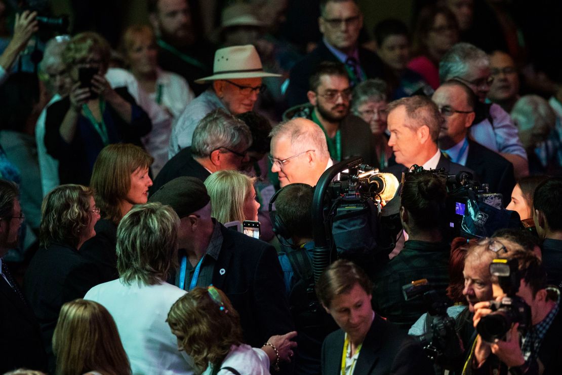 Australia's Prime Minister Scott Morrison (centre L) and opposition Labour leader Bill Shorten (centre R) meet with members of the public in Parliament House in Canberra on October 22.