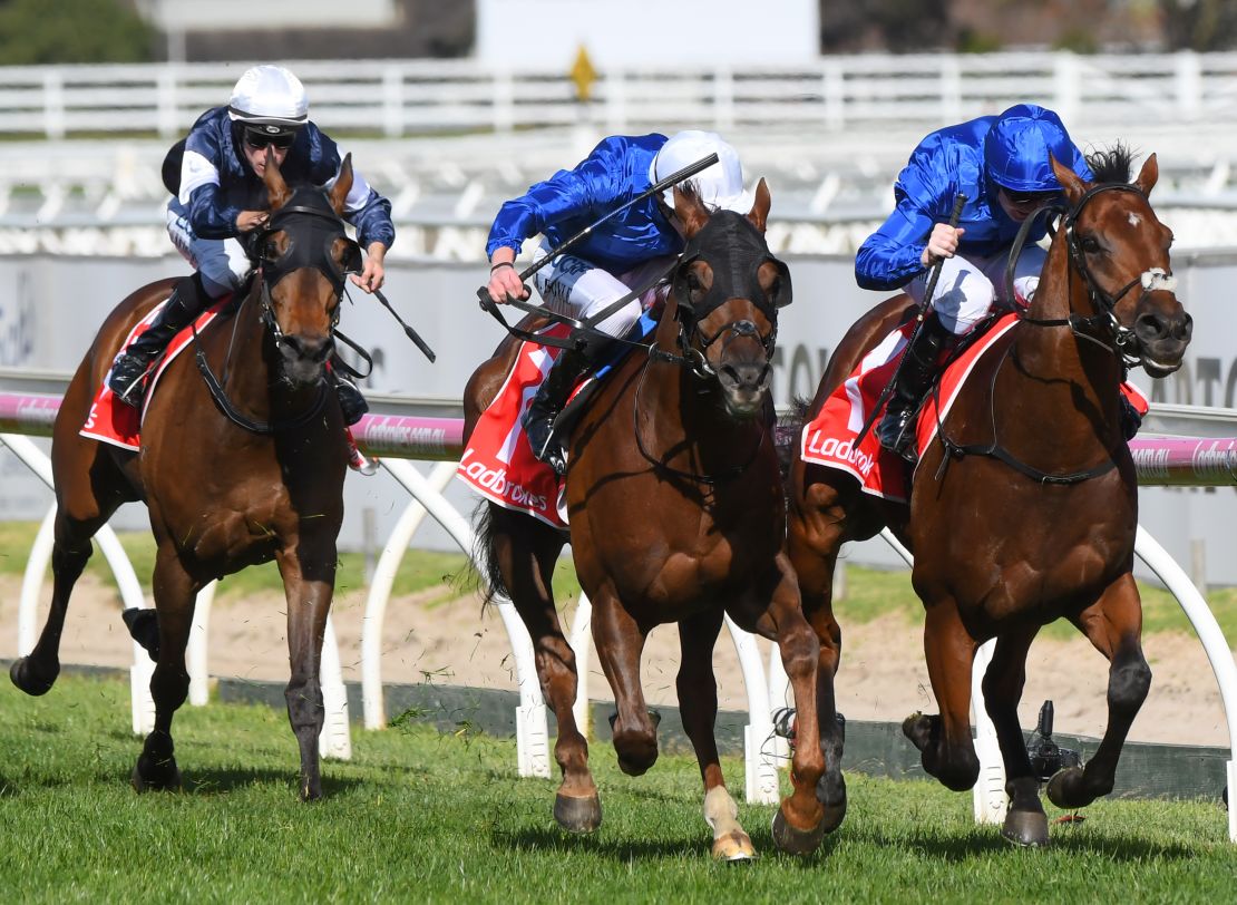 Benbatl (right) edged out Blair House to win the Caulfield Stakes for trainer Saeed bin Suroor.
