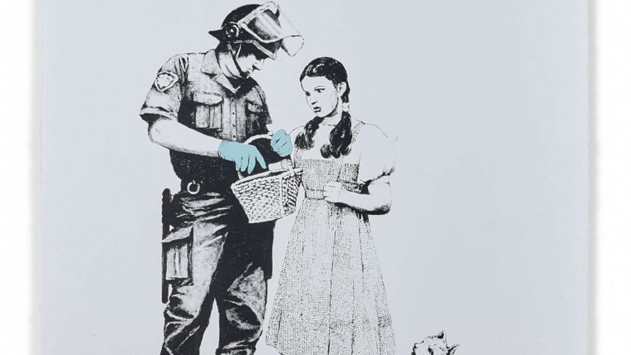 Three Banksy prints are part Artcurial's collection, with bidding starting at €30,000 ($34,400) on the artist's print depicting Dorothy from "The Wizard of Oz" being search by a police officer, titled "Stop and search."