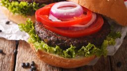 Vegetarian black bean burgers macro on the table. Horizontal; Shutterstock ID 488887894; Job: -