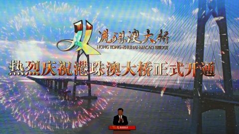 Chinese President Xi Jinping applauds on stage after official opening of the China-Zhuhai-Macau-Hong Kong Bridge, October 23, 2018.
