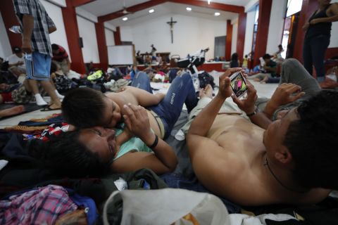 Migrants rest in the town of Huixtla, Mexico.