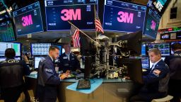 Traders work under monitors displaying 3M Co. signage on the floor of the New York Stock Exchange (NYSE) in New York, U.S., on Monday, Oct. 23, 2017. U.S. stocks got off to a slow start as investors prepared for a big week of earnings reports, awaited possible changes at the Federal Reserve and monitored the progress of tax reform. Photographer: Michael Nagle/Bloomberg via Getty Images