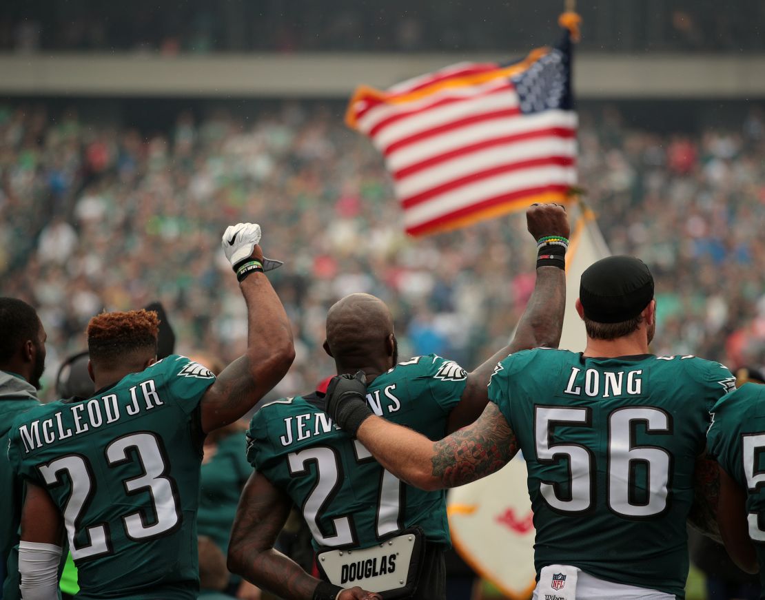 When Malcolm Jenkins raised his fist,  teammate Chris Long offered a public sign of support.
