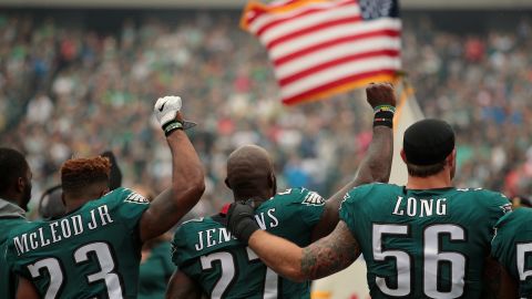When Malcolm Jenkins raised his fist, teammate Chris Long offered a public sign of support.