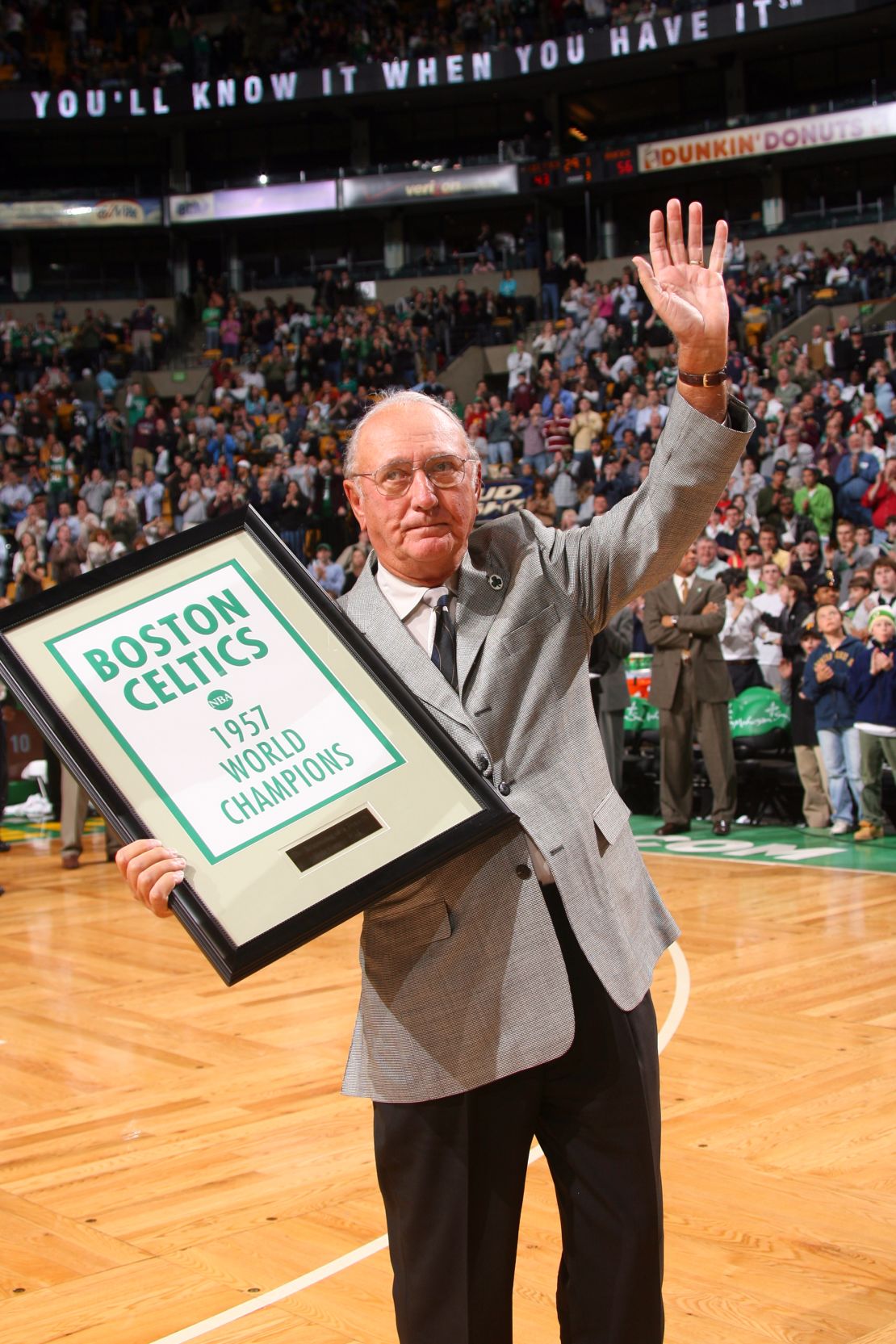 Bob Cousy receives a  banner marking the 50th anniversary of the 1957 championship.