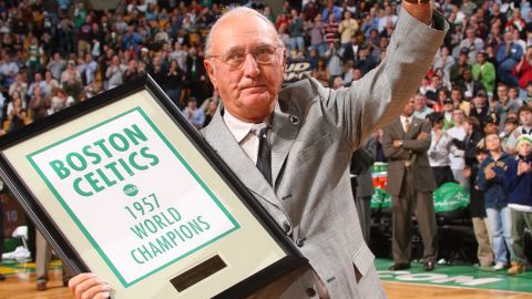 Bob Cousy receives a banner marking the 50th anniversary of the 1957 championship.