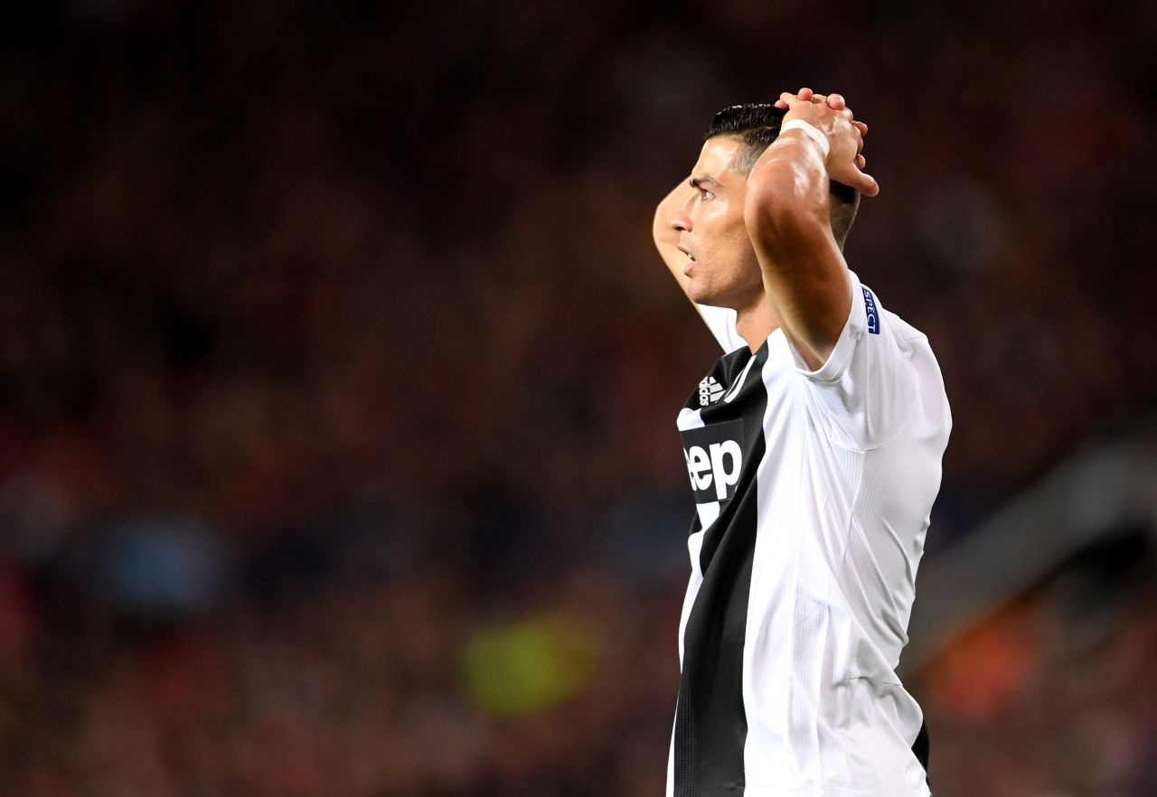 Ronaldo reacts as his goal-bound effort is magnificently saved by Manchester United keeper David de Gea. 