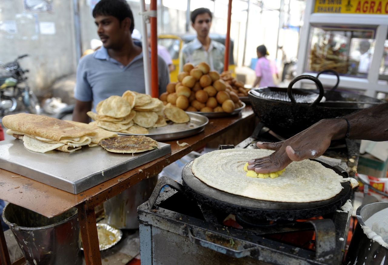 In Hyderabad, streetside vendors prepare masala dosa -- a fermented crepe that's a popular breakfast option.