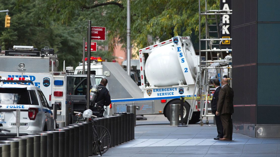 New York police drive a total containment vessel away from Time Warner Center on Wednesday.