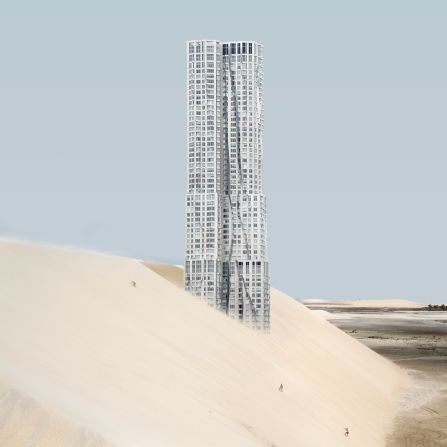 Frank Gehry's 8 Spruce Street, a 76-story residential skyscraper, juts out from a sand dune. Its rippling stainless-steel exterior matches the blue sky. 